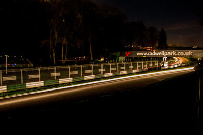 Light trails on street in city at night