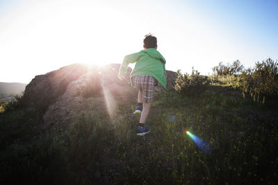 Rear view of man walking on mountain