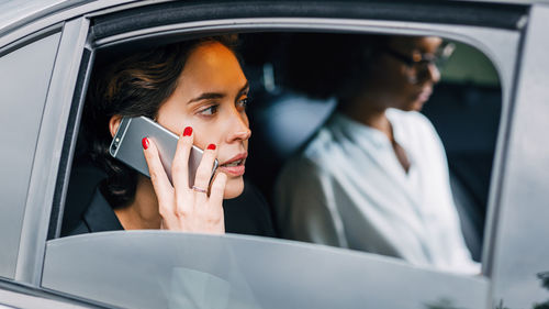 Portrait of young couple in car