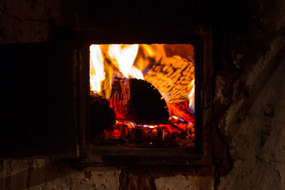 Burning flame of a furnace in a russian village. warmth and comfort in the house