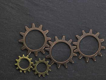 Close-up of gears on black table