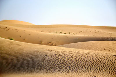 Scenic view of desert against clear sky