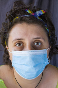 Portrait of young woman with face mask