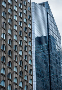 Low angle view of modern building in city against sky