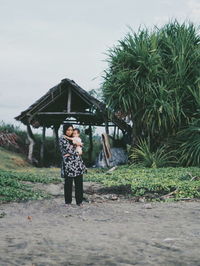 Young woman standing on ground