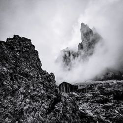 Low angle view of rocks against sky