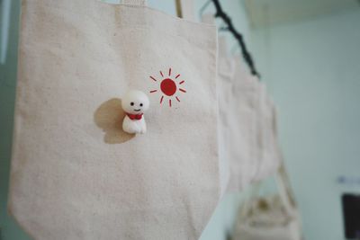 Close-up of shopping bag hanging 