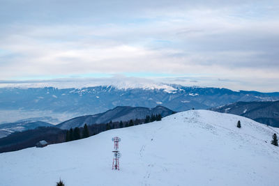 Sun over the winter mountains with snow, cindrel mountains, paltinis, romania