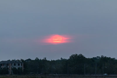 Scenic view of landscape against sky at sunset