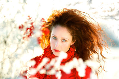 Portrait of a girl with red hair in winter