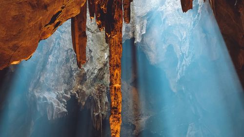 Sunlight falling through rock formation in caves