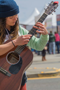 Woman playing guitar