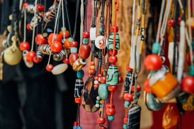 Close-up of jewelry hanging in store for sale