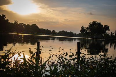 Scenic view of lake against sky during sunset