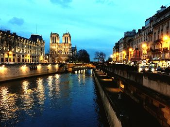 River passing through city at night