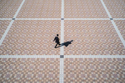 High angle view of woman walking on swimming pool