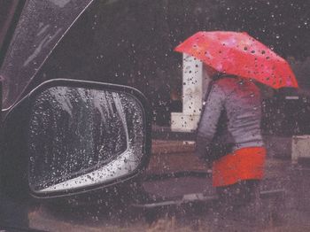 Road seen through wet glass during monsoon