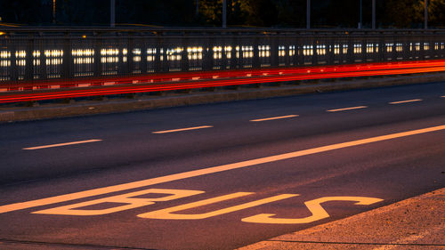 High angle view of light trails on road at night