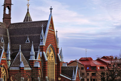 Low angle view of buildings in city against sky