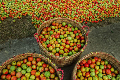 High angle view of fruits in basket at market stall