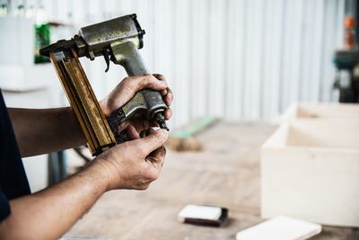 Close-up of man working on wood