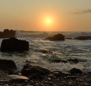 Scenic view of sea against sky during sunset