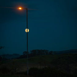 Illuminated street light at night