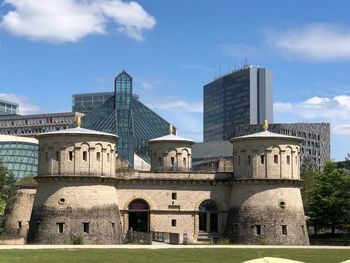 Buildings in city against sky