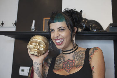 A young woman with a gold skull.