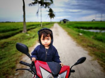 Portrait of smiling man riding bicycle in park