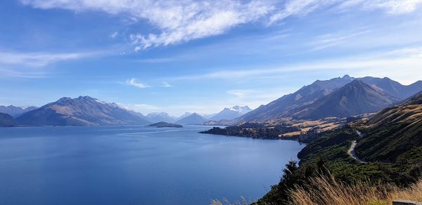 Scenic view of lake and mountains against sky