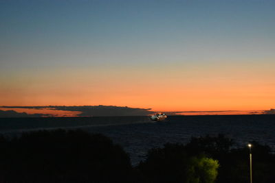 Scenic view of sea against sky at sunset