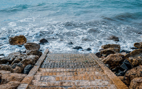 High angle view of rocks on beach