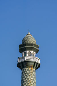 Low angle view of building against blue sky