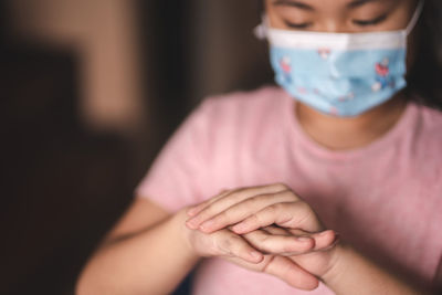 Close-up of woman with hands