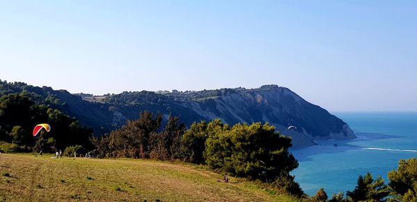 Scenic view of mountains against clear blue sky