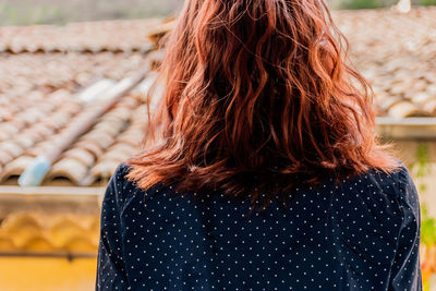 Rear view of woman with redhead