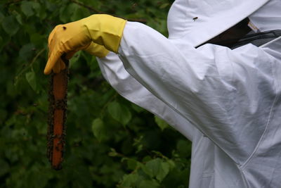 Close-up of beekeeper outdoors