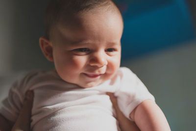 Close-up of cropped woman holding son hand