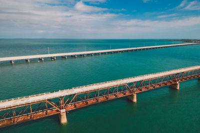 Pier over sea against sky