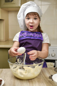 Midsection of woman preparing food at home