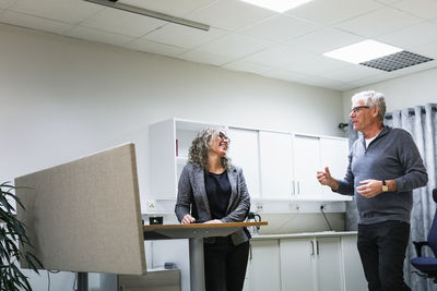 Side view of business colleagues working at office