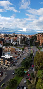 High angle view of street and buildings against sky