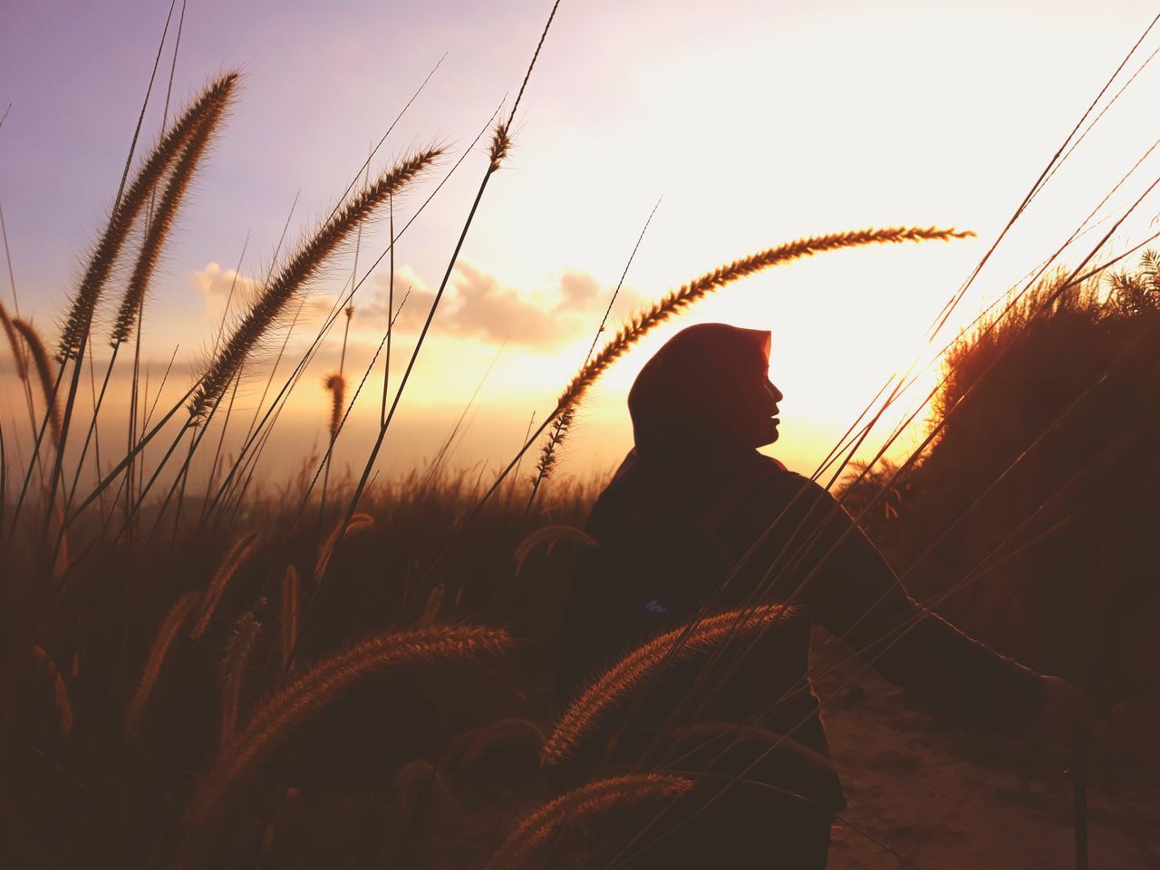 SILHOUETTE PERSON AGAINST SKY AT SUNSET