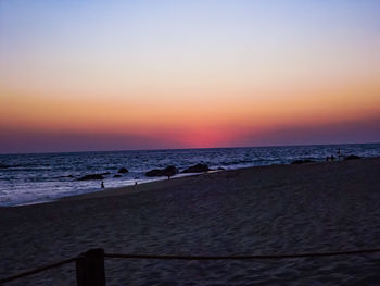Scenic view of sea against clear sky during sunset