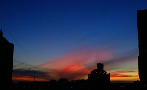 Silhouette of building at sunset