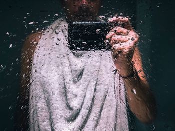 Close-up of wet glass in rainy season