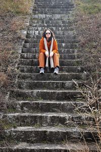 Woman sitting on steps