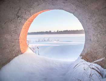 A beautiful winter landscape during sunrise from a low perspective.