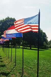 Scenic view of flag against sky